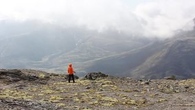 girl stands in the mountains, the clouds run, accelerated video, Russia, Hibiny mountain, august 2013