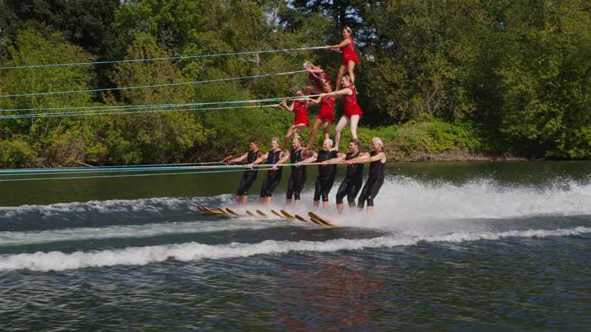 Stunt water skiers form human pyramid Royalty-Free Stock Footage #4583363