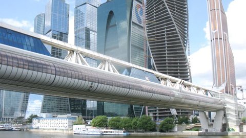 MOSCOW - JUN 16: ( timelapse) Bridge over water near modern architecture buildings at Moscow-City, on Jun 16, 2013 in Moscow, Russia.