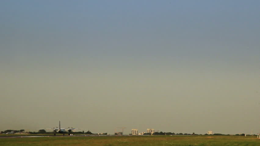 Propeller plane takes of ar dusk