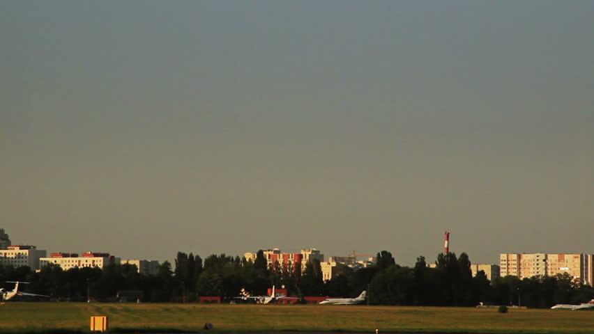 Business jet passing by camera at dusk