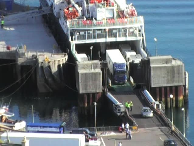 trucks driving off ferry