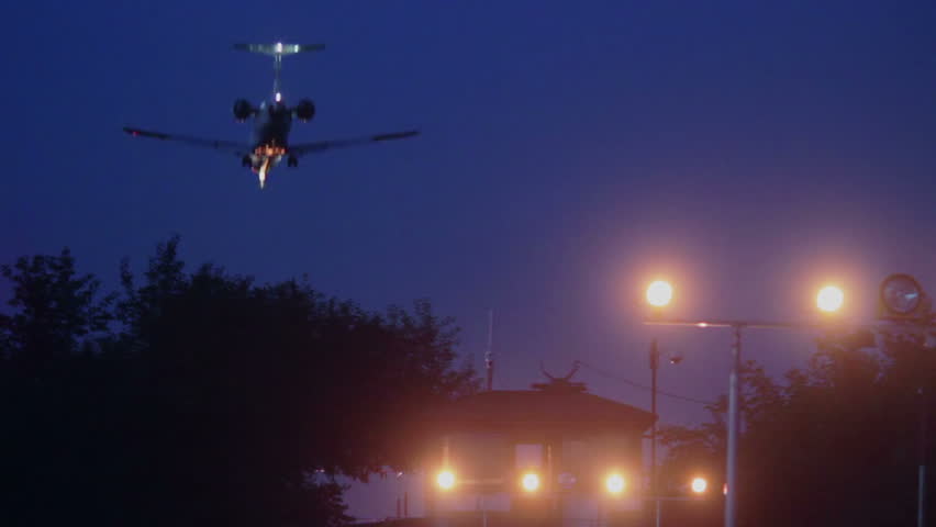 Airliner landing at night, signal lights