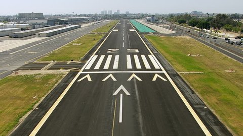 Landing on airport runway, aerial shot Stockvideo