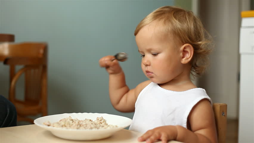 baby eating porridge