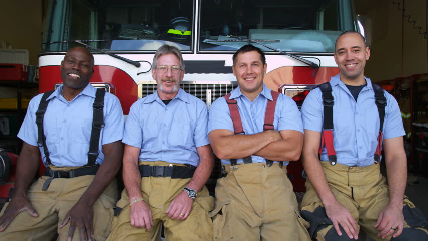 Portrait of firefighter group at station