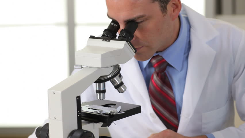 Scientist Looks Into Microscope Stock Footage Video (100% Royalty-free)  4588793 | Shutterstock