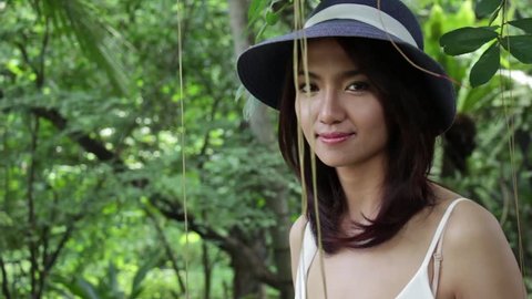 smiling woman in nature : closeup, rig stabilized tracking shot HD
