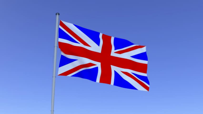 UK Flag flapping in wind against a blue sky