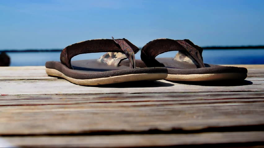 Sandals on a dock.  Shallow DOF.