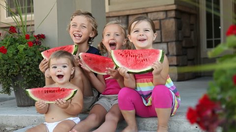Portrait of kids with watermelon, dolly shot