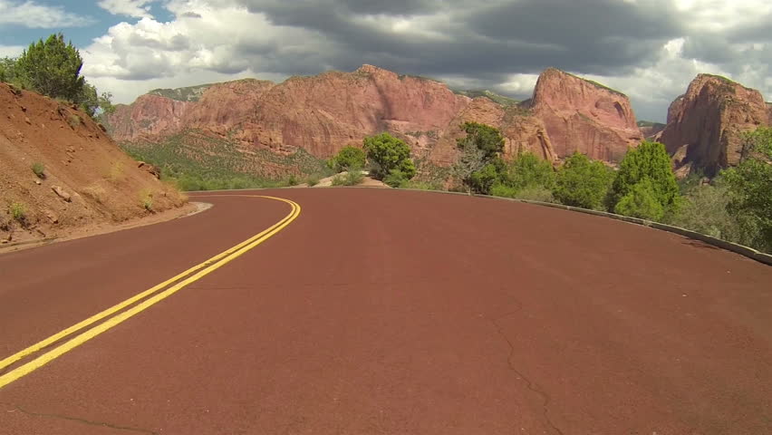 Driving down beautiful Zion National Park 2. Point of view.  Kolob Canyon of the Colorado Plateau, Great Basin and Mojave Desert of southwest Utah. Incredible red Navajo Sandstone mountains.