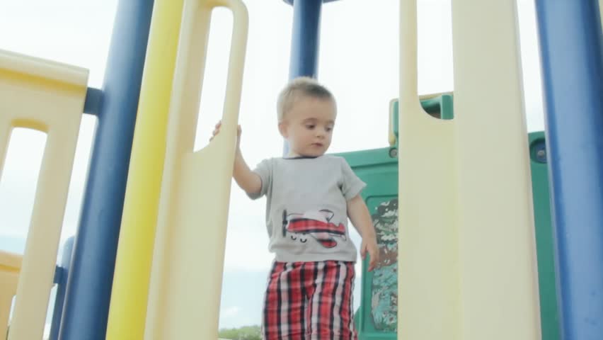 a little boy having fun on a playground