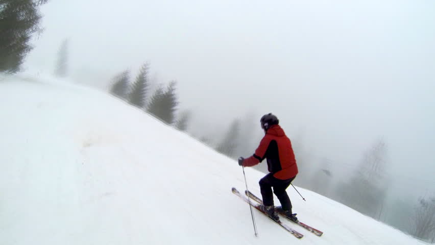 Motion camera view of skier is riding in the mountains