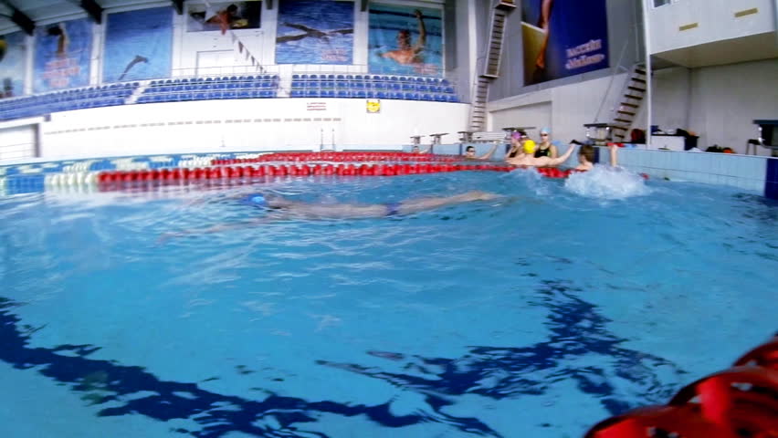 Beautiful slow motion view of athlete who is swim backstorke style