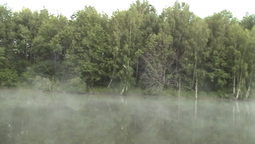 The Morning on lake. The Mist on water.
