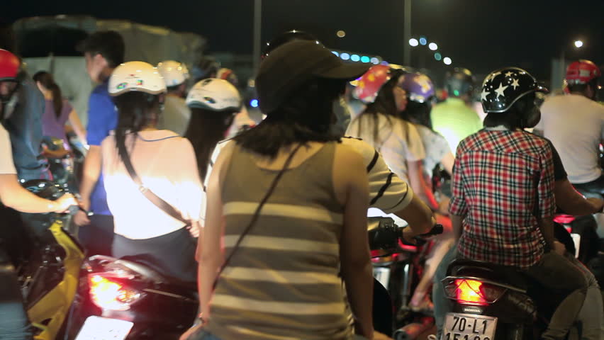 HO CHI MINH CITY - SEPTEMBER 2: Vietnamese people are riding bikes on busy