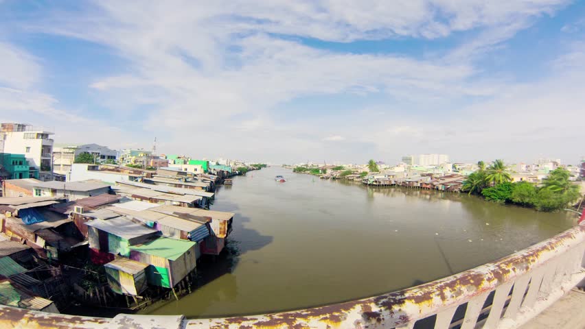 SAIGON - JULY 26: Slums on the banks of Saigon river on July 26, 2013 in Saigon