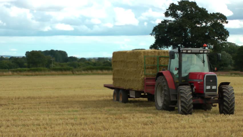 Agriculture - Tractor Loading Bales