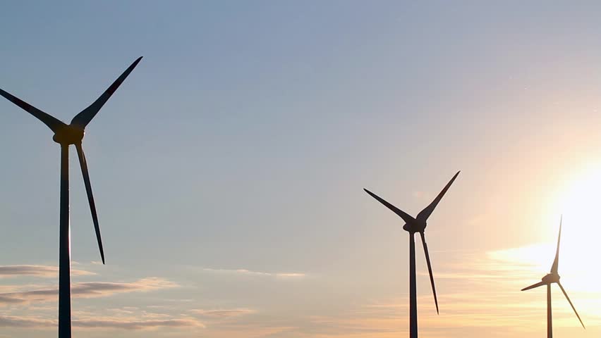 wind generators at sunset