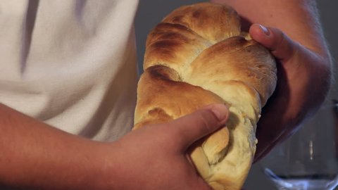 Breaking a homemade bread