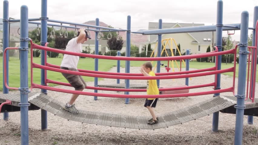 A father playing with his kids at the park