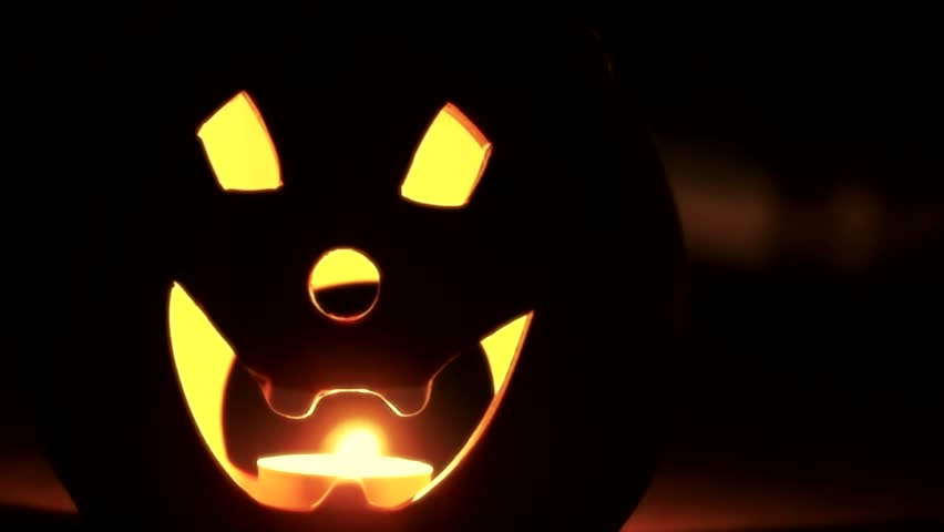 Jack o'latern silhouetted dolly shot.This high definition footage would fit