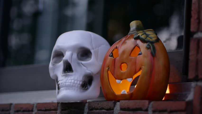 Jack o'latern and skull.This high definition footage would fit perfectly in any