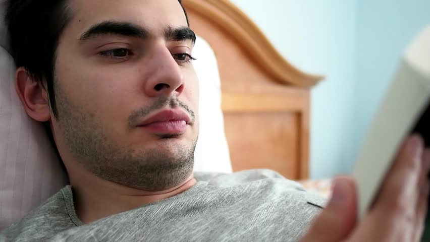 Reading a book in bed during the morning