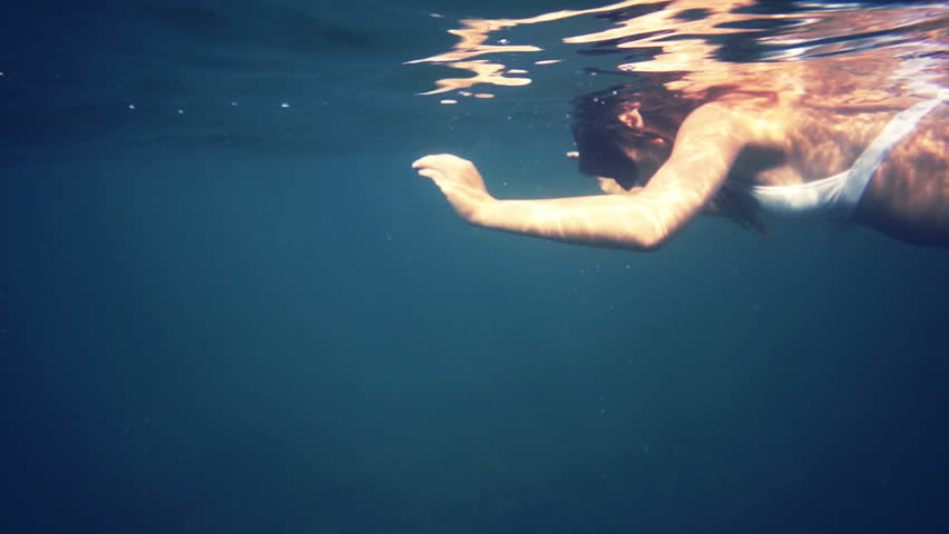 Woman underwater, diving, snorkel