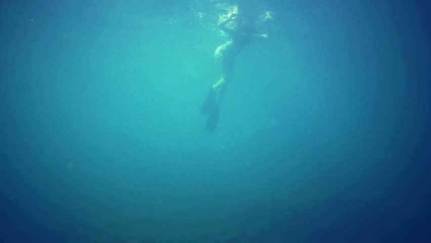 Woman underwater, diving, snorkel