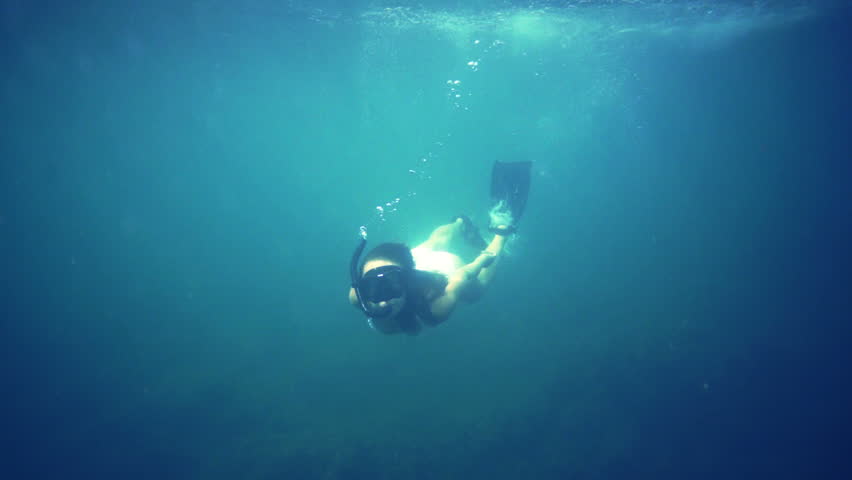 Woman underwater, diving, snorkel