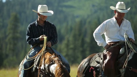 Cowboys on horseback