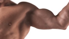 Close up shot of a muscular bodybuilder flexing his large muscles on a white background