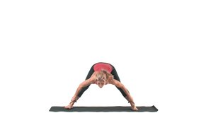 Wide shot of a white female doing yoga poses, on a mat, on a white background