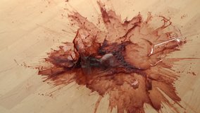 Dropping glass of red wine and breaking on wooden floor shooting with high speed camera, phantom flex. - Powered by Shutterstock - Get 15% off with code: PIKWIZARD15