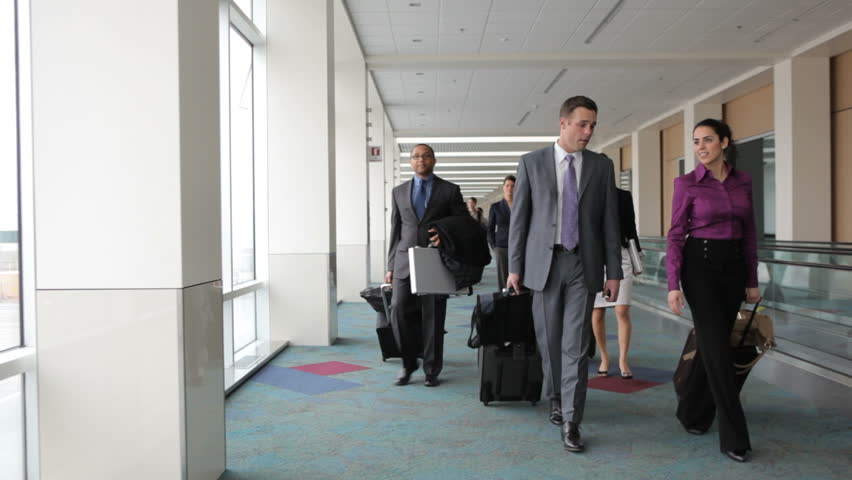 business people walk through airport lobby Stock Footage Video (100% ...