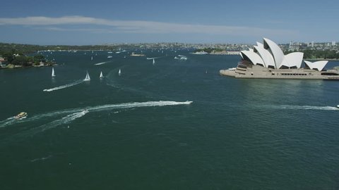 SYDNEY - CIRCA OCTOBER 2009: The Opera House with Ferry Boats passing
