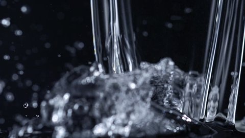 Pouring water on black background shooting with high speed camera, phantom flex.