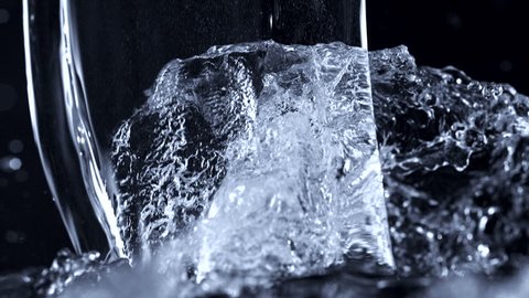 Pouring water on black background shooting with high speed camera, phantom flex.