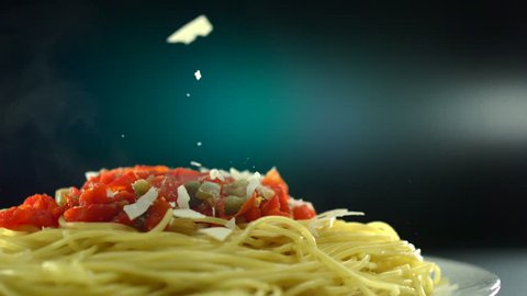 Putting parmesan cheese on spaghetti shooting with high speed camera, phantom flex.