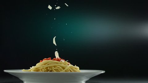 Putting parmesan cheese on spaghetti shooting with high speed camera, phantom flex.