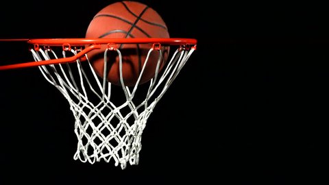 Basketball falls through hoop, slow motion