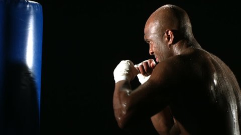 Boxer hits punching bag
