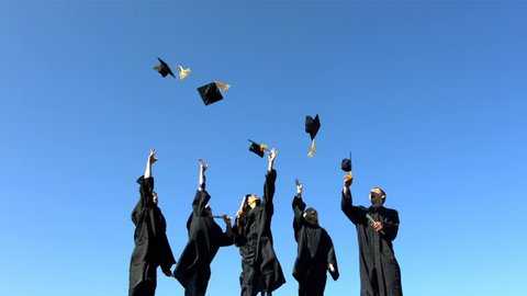 Graduates toss caps into sky