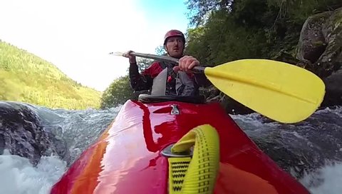 Whitewater kayaking, flip and roll, slow motion