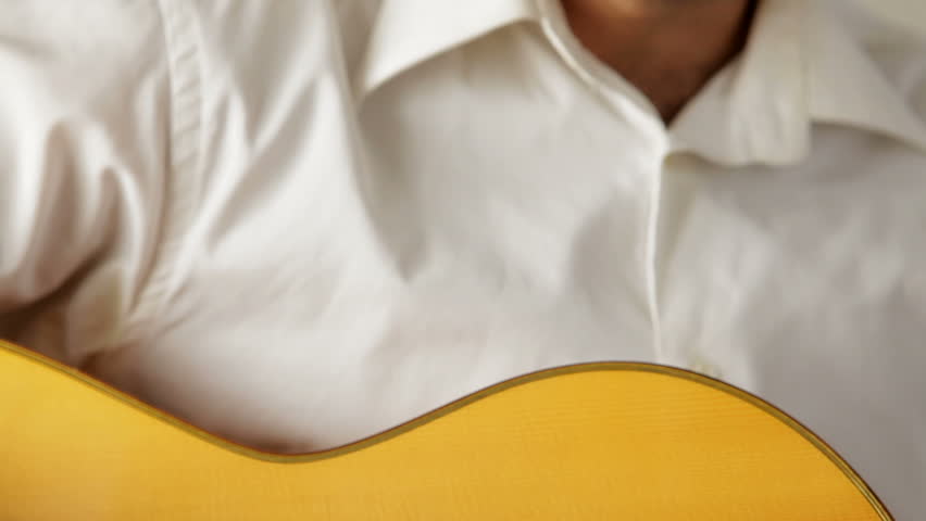 Camera pan on a man playing flamenco with a spanish guitar with 
strings muted Royalty-Free Stock Footage #4639148