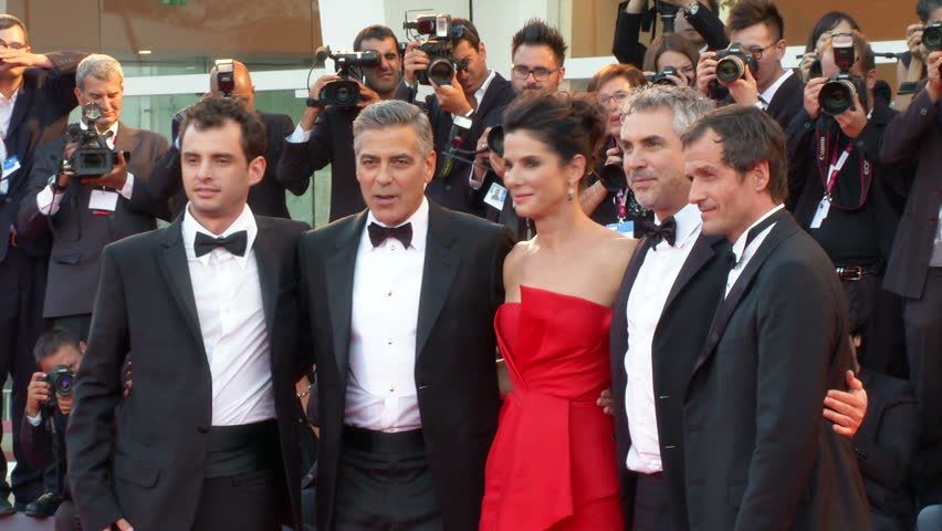 VENICE - AUGUST 28: George Clooney, Sandra Bullock and Alfonso CuarÃ³n on the