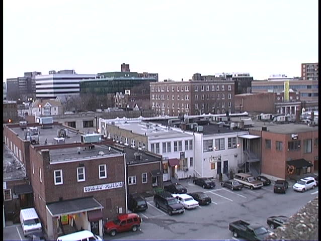 Overhead view of low buildings downtown with parking lot