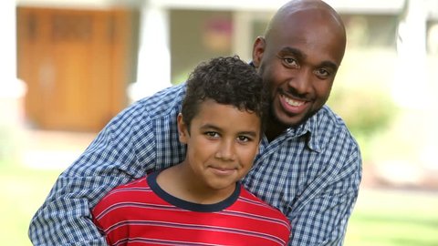 Portrait of African American father and son : stockvideo